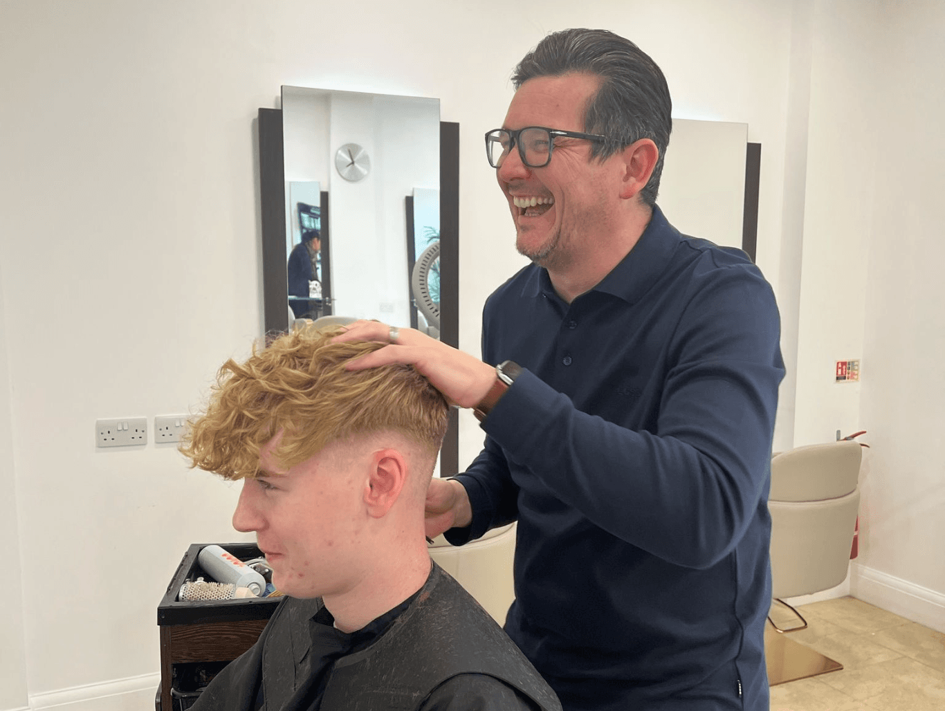 Salon director giving a modern men’s haircut at Nicolas Ablitt Hair Studio in Corringham