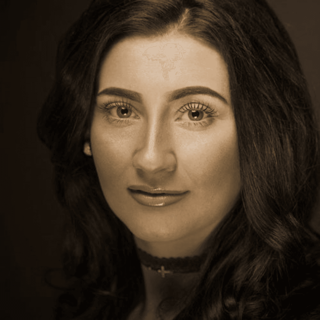 Portrait of Lauren, Art Director at Nicolas Ablitt Hair Studio in Corringham, Essex. Lauren specialises in creative cutting, precision colouring, and luxurious styling, ensuring each client enjoys a personalised and relaxing salon experience.